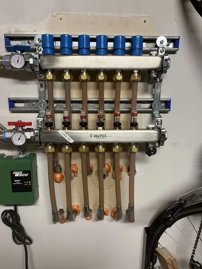 Plumber performing Water Heater Repair at a residential property in New Baden